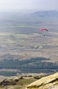 Flying a paraglider in the sky over the mountains, aerial pilot pov Royalty Free Stock Photo