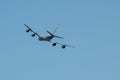 Flying passenger aircraft against a blue sky