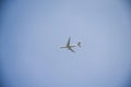 Flying passenger plane in blue sky Royalty Free Stock Photo