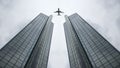 Flying passenger plane in the net on the background of a large modern building