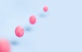 Flying pink chiken eggs on a blue background Royalty Free Stock Photo