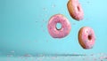 Flying pink sprinkled donuts. Sweet doughnut on pastel blue background