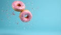 Flying pink sprinkled donuts. Sweet doughnut on pastel blue background