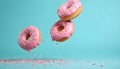 Flying pink sprinkled donuts. Sweet doughnut on pastel blue background