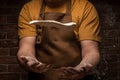 Flying pizza dough with flour scattering in a freeze motion of a cloud of flour midair on black. Cook hands kneading dough. copy Royalty Free Stock Photo