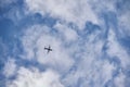 Flying plane in the blue sky