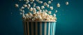 Flying Popcorn from Striped Bowl with Dark Background Royalty Free Stock Photo