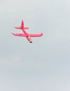 Flying red toy plane Royalty Free Stock Photo