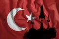 Flying rockets against the background of the Turkish flag waving in the wind. Colorful national flag of Turkey. Patriotism,