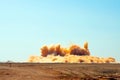 Flying rocks and dust clouds during detonator blast Royalty Free Stock Photo