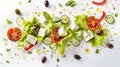 Flying salad isolated on white background Greek salad: red tomatoes, pepper, cheese, lettuce, cucumber, olives, and olive oil Royalty Free Stock Photo