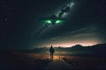 Flying saucer flies at night in sky oversilhouette of man standing in field. Invasion of extraterrestrial intelligence Royalty Free Stock Photo