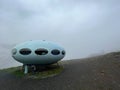 hotel is in the form of a flying saucer on the mountain, flying saucer in the mountains, UFO in the mountains