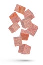 Flying sausage. Cubes of smoked sausage on a white isolated background. Salami cubes fall on a white background, for