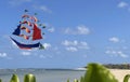 flying ship, rainbow colored ship kite flies on the blue sky and cloud Royalty Free Stock Photo