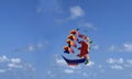 flying ship, rainbow colored ship kite flies on the blue sky and cloud Royalty Free Stock Photo
