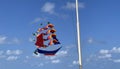 flying ship, rainbow colored ship kite flies on the blue sky and cloud Royalty Free Stock Photo