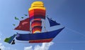 flying ship, rainbow colored ship kite flies on the blue sky and cloud Royalty Free Stock Photo