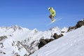 Flying skier on mountains. Extreme winter sport.