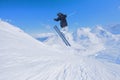 Flying skier on mountains. Extreme winter sport.