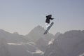 Flying skier on mountains. Extreme winter sport.