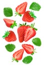 flying Sliced strawberry with green leaves isolated on white background. clipping path