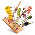 Flying slices of sliced vegetables are served on a wooden board Royalty Free Stock Photo