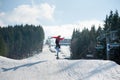 Flying snowboarder at jump from the slope of mountain Royalty Free Stock Photo