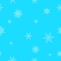 Flying snowflakes on a light blue background. Abstract snowflakes seamless pattern. Falling snow Royalty Free Stock Photo