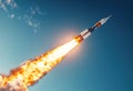 flying space rocket on blue sky background Royalty Free Stock Photo