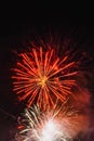 Flying sparks of holiday fireworks, colorful smoke and bright nebula on black sky. Festive background