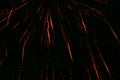 Flying splashes of fireworks, red-yellow, against the background of the night sky Royalty Free Stock Photo