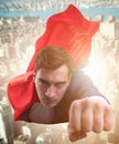 The flying super hero over the city Royalty Free Stock Photo