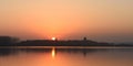 Flying swans,Sunset, Tower, Lake Royalty Free Stock Photo