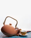 Flying teapot, tea cup. To pour tea. Drops. White background. Royalty Free Stock Photo