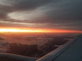 Flying to the sun view airplane window Royalty Free Stock Photo