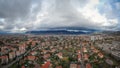 Flying between the town and stormy sky. Royalty Free Stock Photo