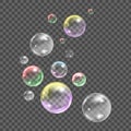 Flying transparent soap bubbles on checkered background.