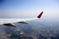 Flying and traveling, view from airplane window on the wing