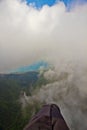 Flying under the clouds along the turquoise sea and the green coast with many hotels. aerial photo from a paraglider, summer Royalty Free Stock Photo