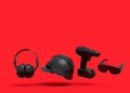 Flying view of black construction tools for repair on red background Royalty Free Stock Photo