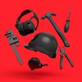 Flying view of black construction tools for repair on red background Royalty Free Stock Photo