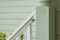 Flying wasp approaches wood pillar of exterior porch Royalty Free Stock Photo