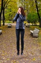 Flying woman in autumn park