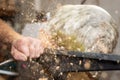 Flying wooden sawdust shavings while creating timber bowl