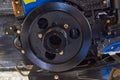 Flywheel on a tractor,flywheel damper for diesel engine on a two wheeled tractor Royalty Free Stock Photo