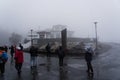 The FlÃÂ¸ien Folkerestaurant restaurant on a wet and rainy day with tourists. Bergen Norway