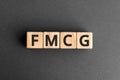 FMCG - acronym from wooden blocks with letters