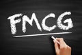 FMCG Fast Moving Consumer Goods - products that are sold quickly and at a relatively low cost, acronym text on blackboard