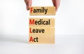 FMLA family medical leave act symbol. Concept words FMLA family medical leave act on wooden blocks on a beautiful white background Royalty Free Stock Photo